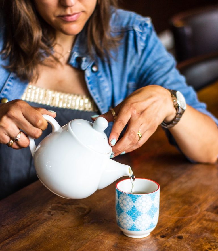 woman holding teapot